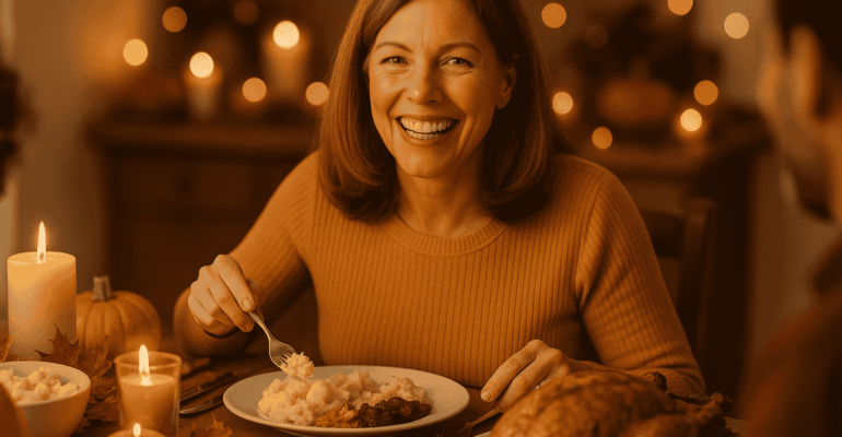 Woman smiling confidently at Thanksgiving dinner after getting the best dental implants near me for Thanksgiving dinner